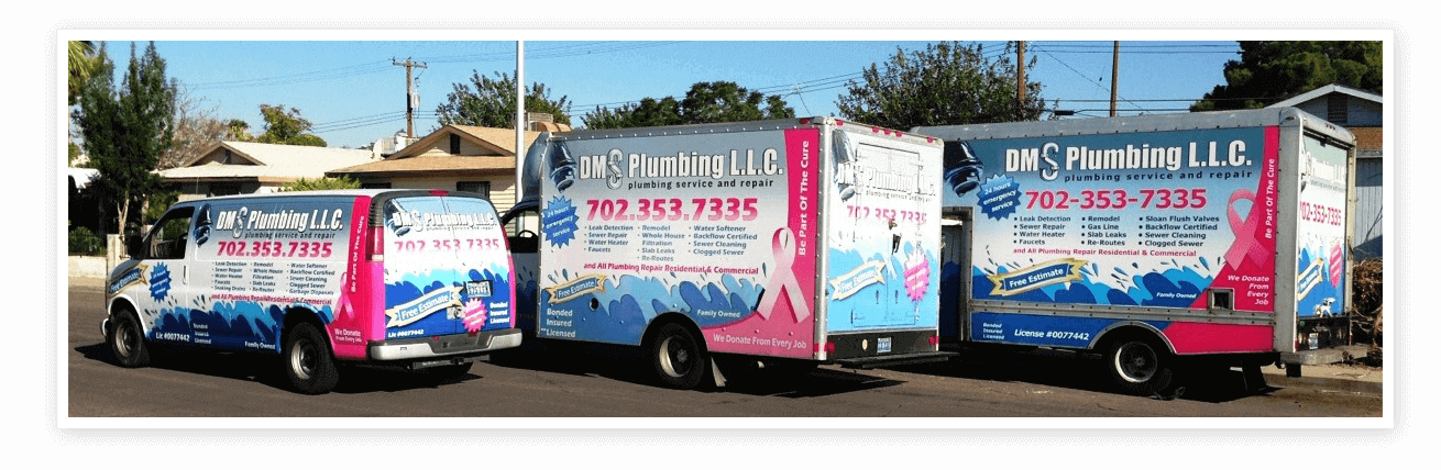 A truck with pink ribbon on the side of it.