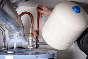 Plumber Repairing Water Heater
