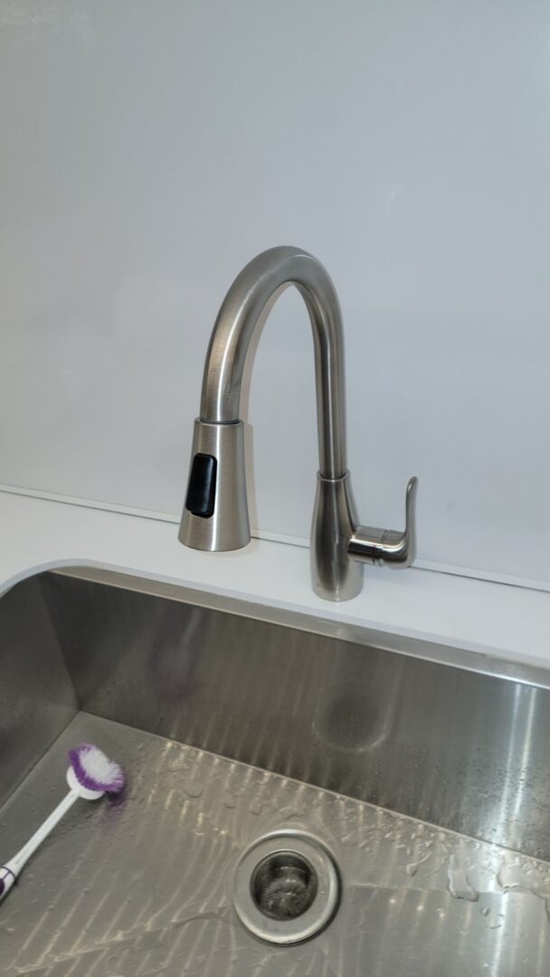 New pull-down kitchen faucet installed by DMS Plumbing