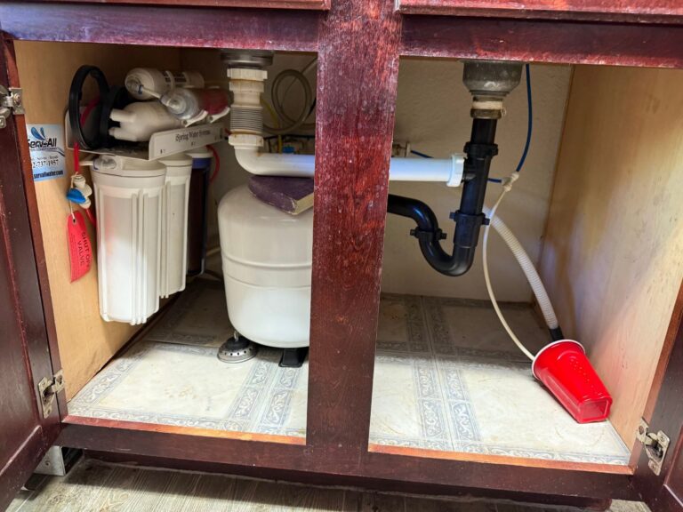 Under-sink plumbing with a reverse osmosis system in a Las Vegas kitchen